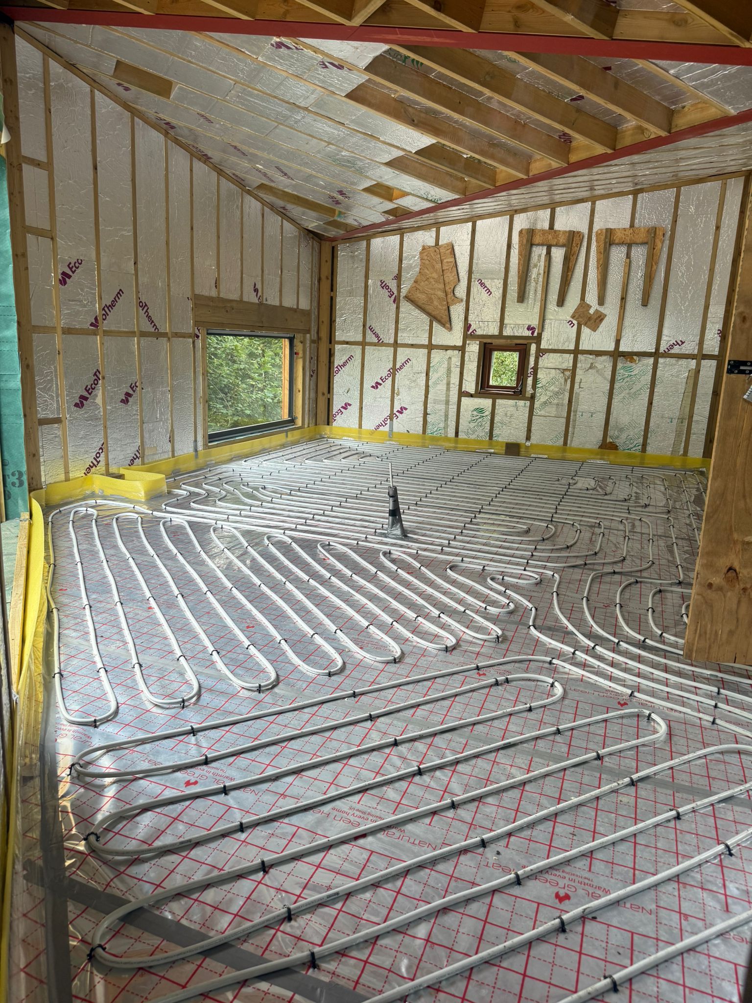 Full screed underfloor heating pipework laid for an air source heat pump system