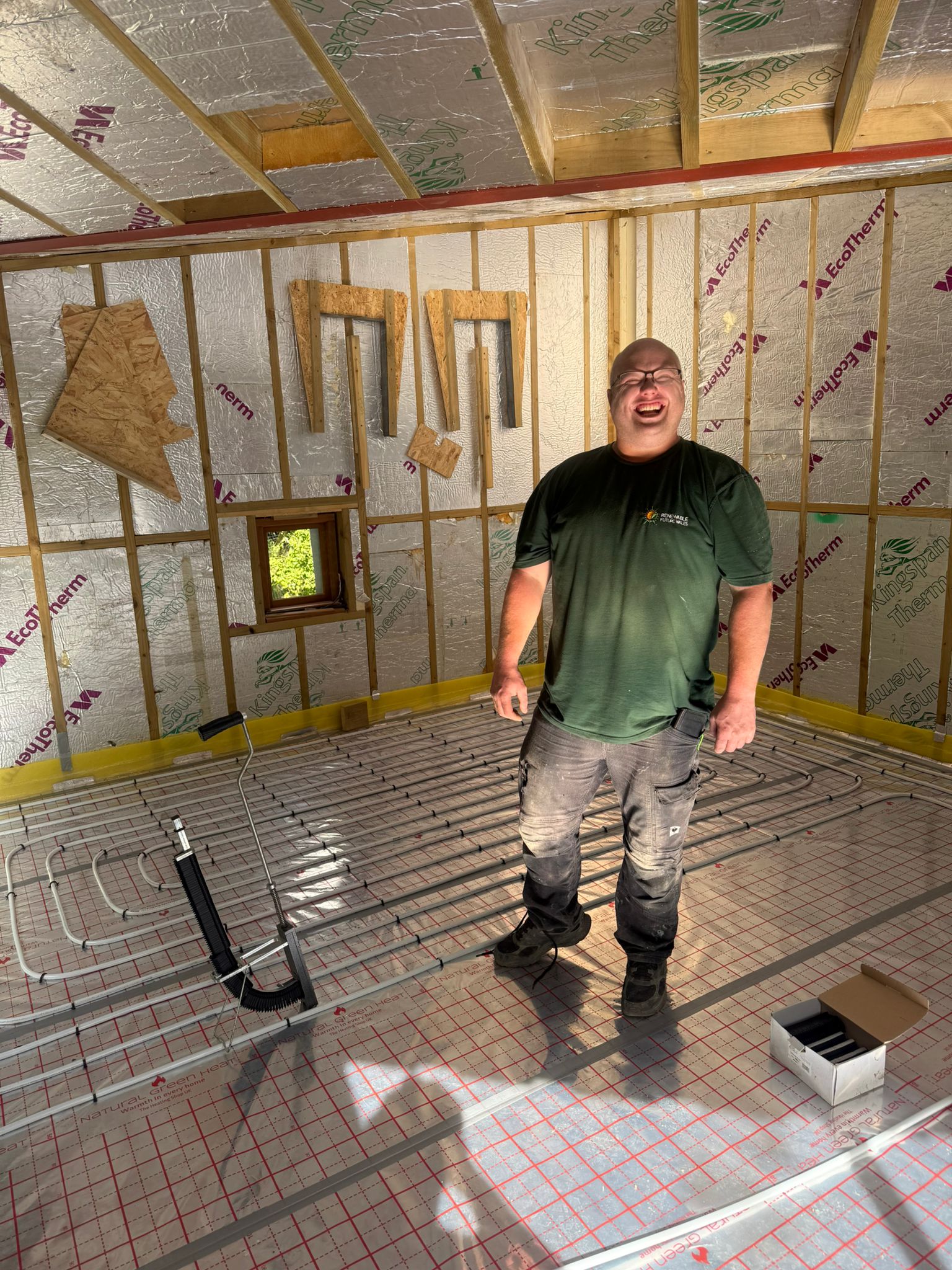 Full screed underfloor heating pipework laid for an air source heat pump system