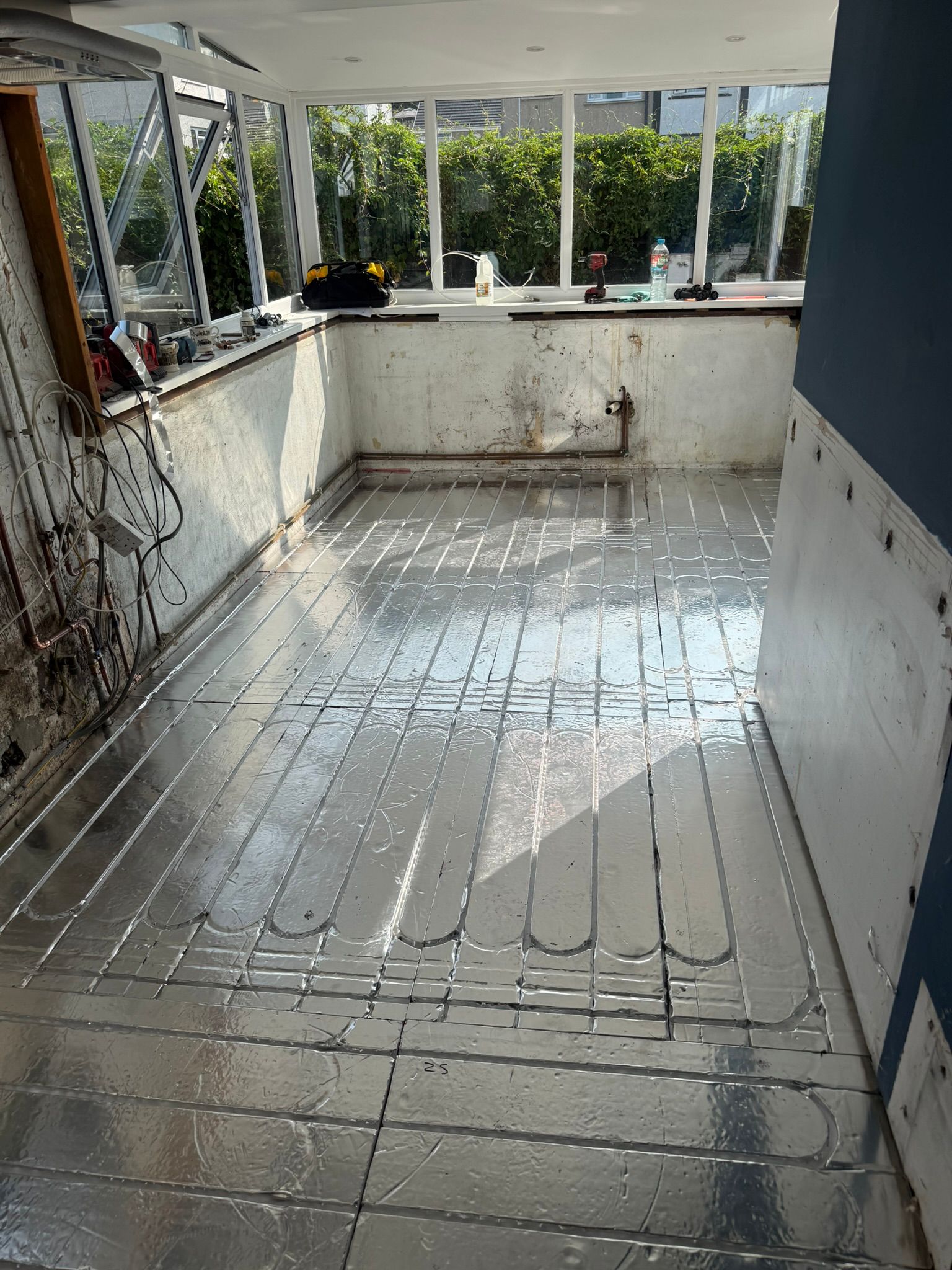 Low-profile underfloor heating retrofit suitable for renovations and stone cottages
