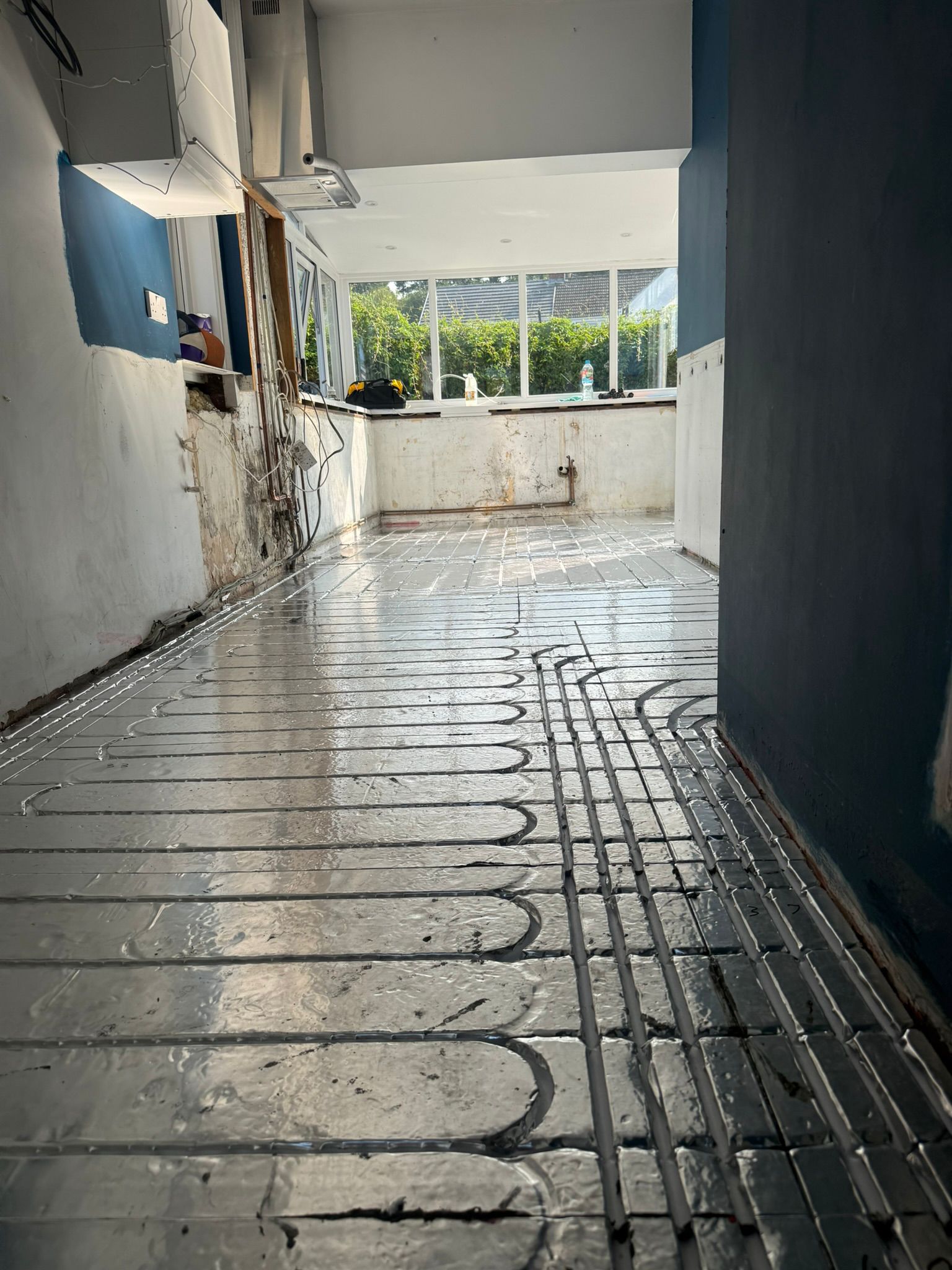 Low-profile underfloor heating retrofit suitable for renovations and stone cottages